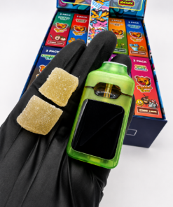 Buddah Bear disposable vape with green device and two gummies