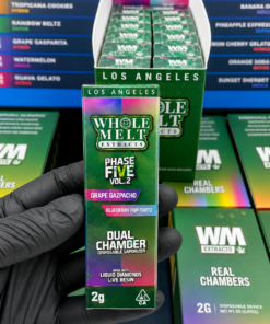 Whole Melt V5 2G Dual Chamber Disposable vape packaging with WM Extracts branding and dual chamber design.