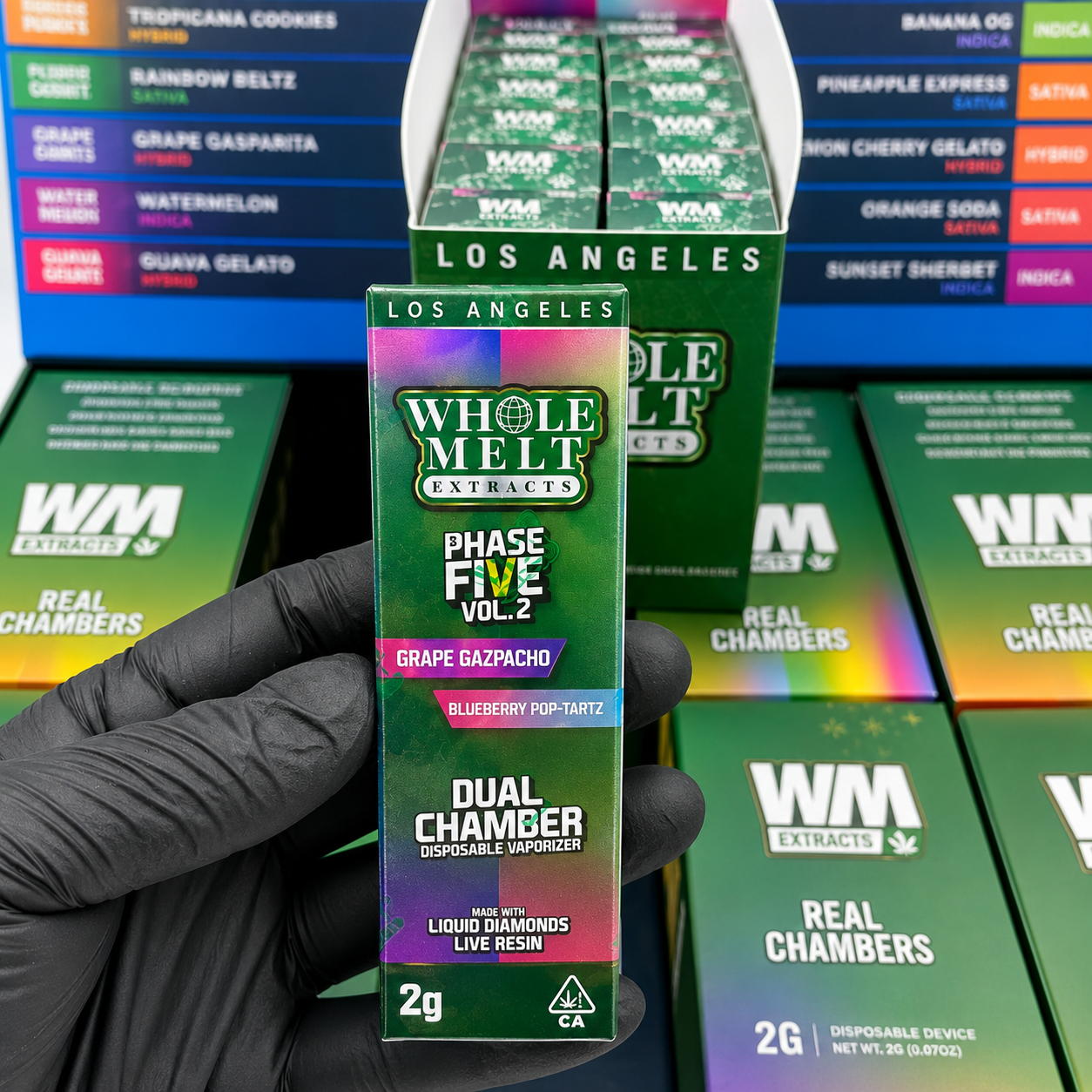 Whole Melt V5 2G Dual Chamber Disposable vape packaging with WM Extracts branding and dual chamber design.